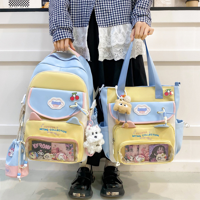 Mochila de tres piezas de estilo nuevo al por mayor para estudiantes de primaria y secundaria, mochila escolar de alto valor y gran capacidad, mochila de viaje de ocio simple