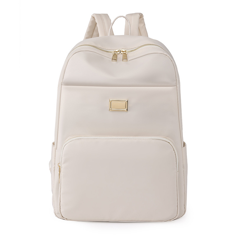 Comercio exterior al por mayor 2023 verano nuevo estilo versión coreana de las señoras mochila de nailon mochila simple de color sólido de gran capacidad para estudiantes