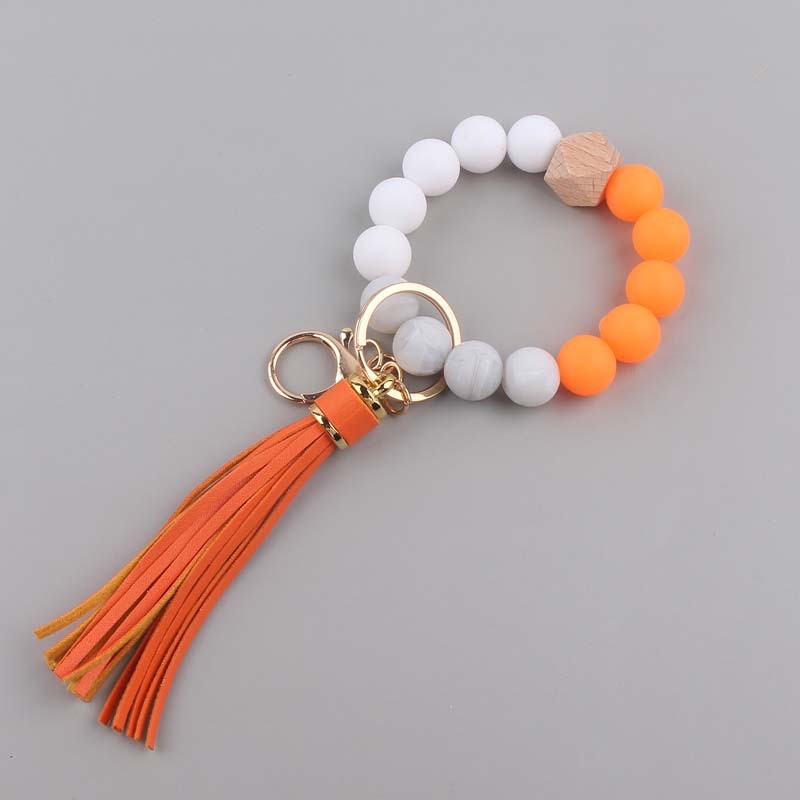 Nuevo cuero creativo pu borla colgante silicona muñeca llavero colgante silicona cuentas pulsera llavero