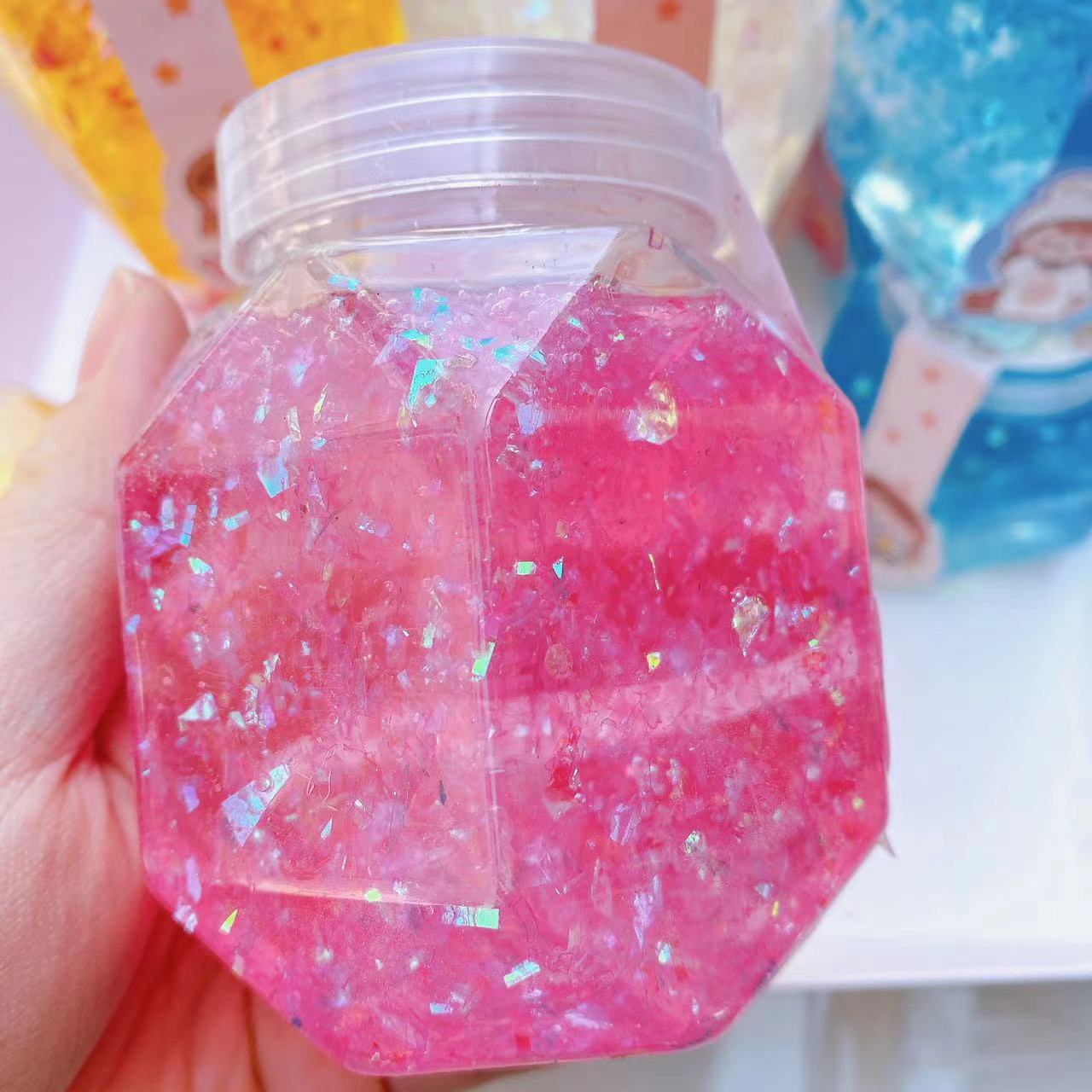 Juguetes para niños barro de color barro de cristal goma espumante alta permeabilidad color brillante barro hexagonal DIY descomprimido 2 yuanes al por mayor
