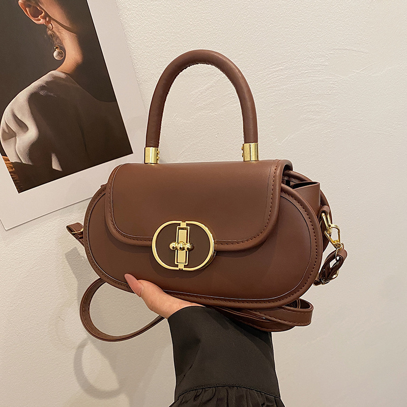 Bolso de diseño de nicho de textura 2024 invierno nuevo bolso de mujer moda manzana bloqueo mochila bolso de mano de estilo occidental