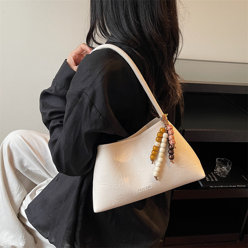Bolsas transfronterizas para mujeres 2025, otoño y invierno, nuevo bolso coreano, bolso de brazo retro, bolso de hombro simple de moda para mujeres.