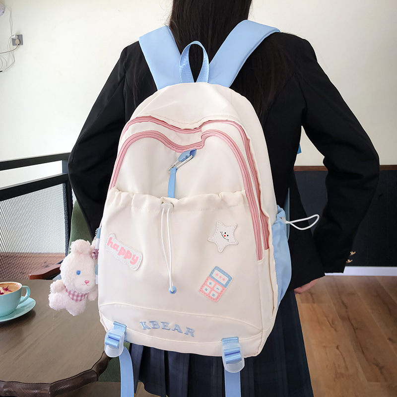 Nueva mochila de dibujos animados simple para estudiantes de secundaria y secundaria