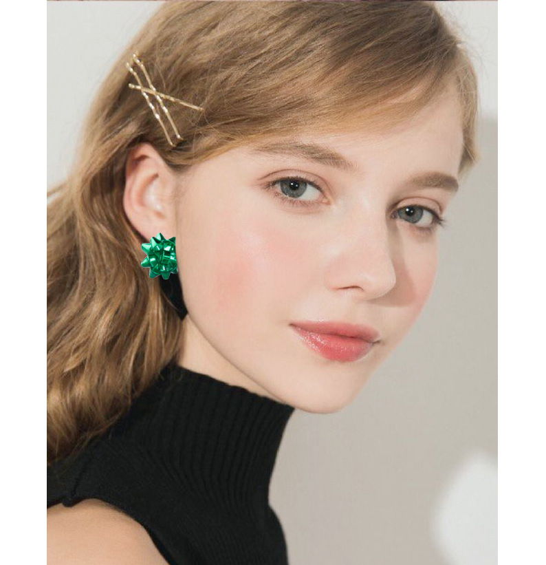 Europa y América nueva Navidad pendientes de metal simple Flor de Navidad regalo de las mujeres arco creativo pendientes en stock al por mayor