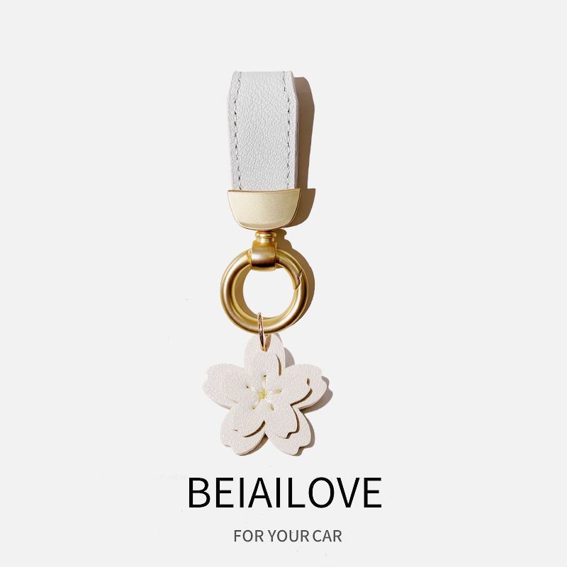 Estilo francés de alta gama de cuero fresco cuerda coche llavero simple lindo clave colgante Pequeño Libro Rojo mismo estilo girasol