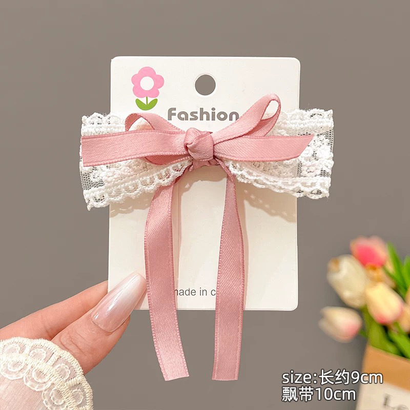 Розовая заколка для волос с бантиком