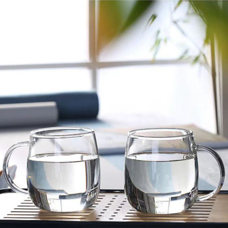 Copo de vidro borossilicato de alta qualidade para uso doméstico, com alça transparente na cor café, ideal para chá verde ou sucos, café da manhã ou leite._voghion.com