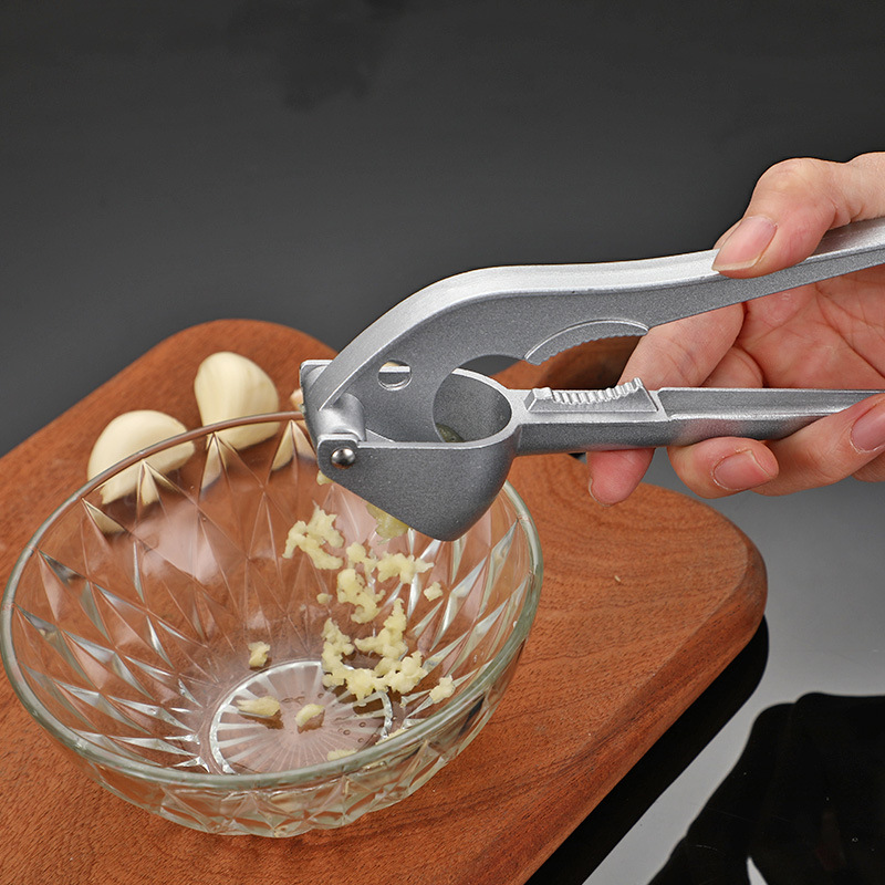 Triturador de nueces y frutos secos para el hogar, prensa manual de ajo, triturador de pasta de ajo, abridor de cáscaras, herramienta de cocina multifuncional. image 3