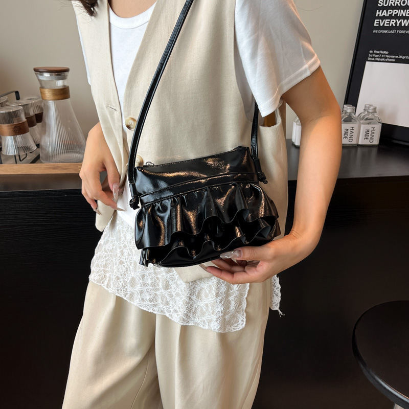 Bolso pequeño de moda coreana 2025 verano nuevo bolso femenino plisado con volantes bolso bandolera salvaje estilo occidental