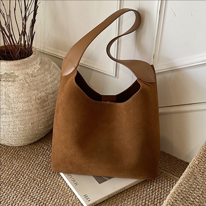 Bolsas de mano retro transfronterizas de mujer texturas bolsas de cubo de agua mujeres otoño y invierno 2025 nuevo mochila esmerizada bolsas de brazo de viaje