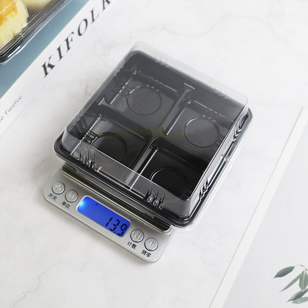 Cuatro cajas de punto oeste, cuatro puffs de nieve, cuatro granos de mantequilla de huevo, 50 g de pastel de luna, caja de embalaje desechable para hornear.