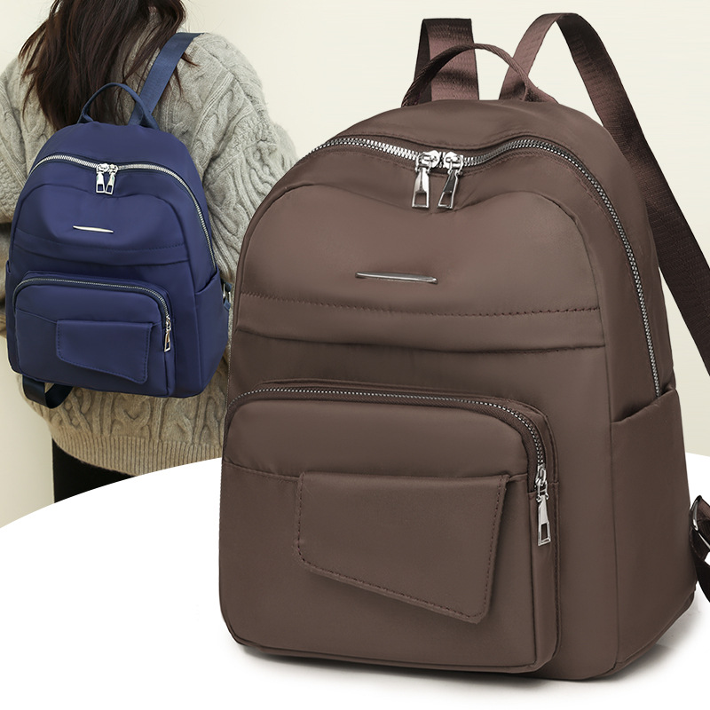 Mochila de nailon de gran capacidad para mujer 2024 nueva mochila casual al aire libre mochila de viaje ligera al por mayor