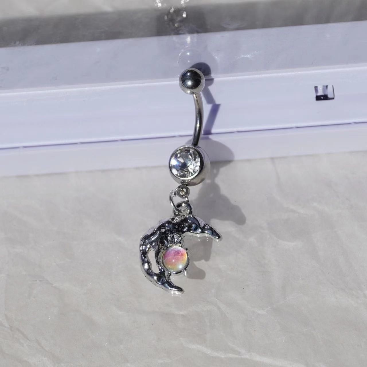 Piercing de umbigo estrela e lua em aço inoxidável com zircónia_voghion.com
