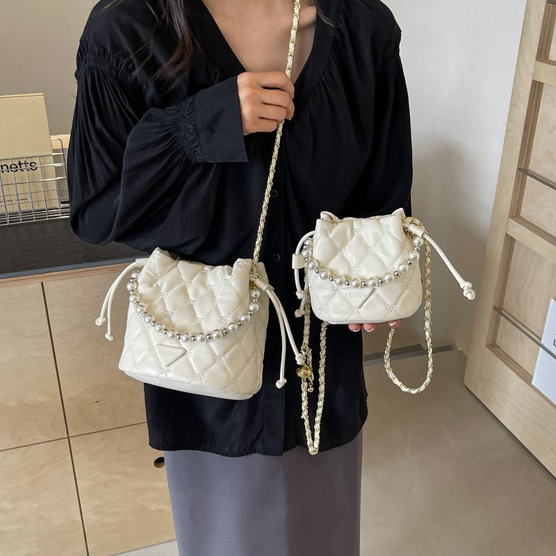夏季新款流行水桶包女2024時尚珍珠手提單肩包百搭潮流斜挎包女包