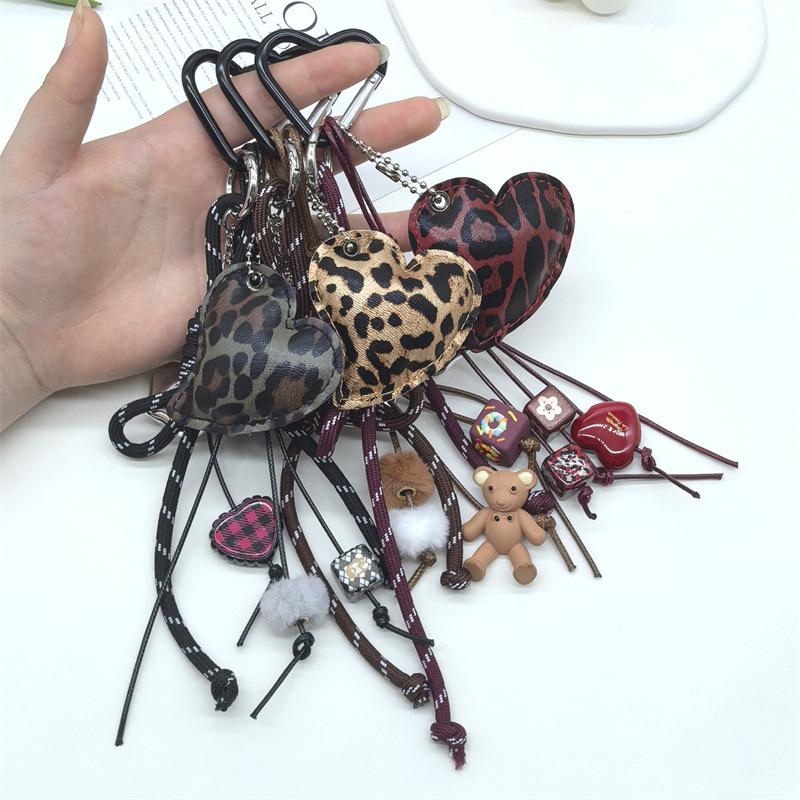 New Miu style bow leopard print PU leather heart-shaped keychain, unique heart-shaped charm for bags.