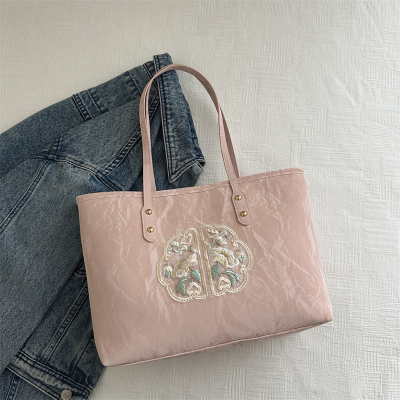 Bolsa de mano de alta calidad de alta capacidad de textura de transporte de verano 2024 nuevo estilo versátil para trabajar bolsas de hombro