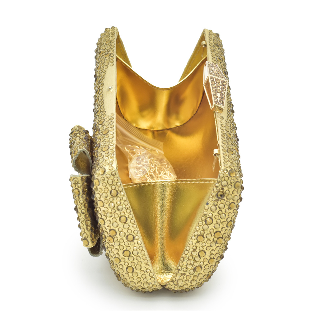 Accessorize the evening with applique studded high-heeled sandals and a full cloth small flash diamond dinner bag set with sandals_voghion.com