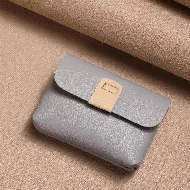 2025新款口红真皮包简约复古按扣小皮包蓝牙耳机收纳包硬币包