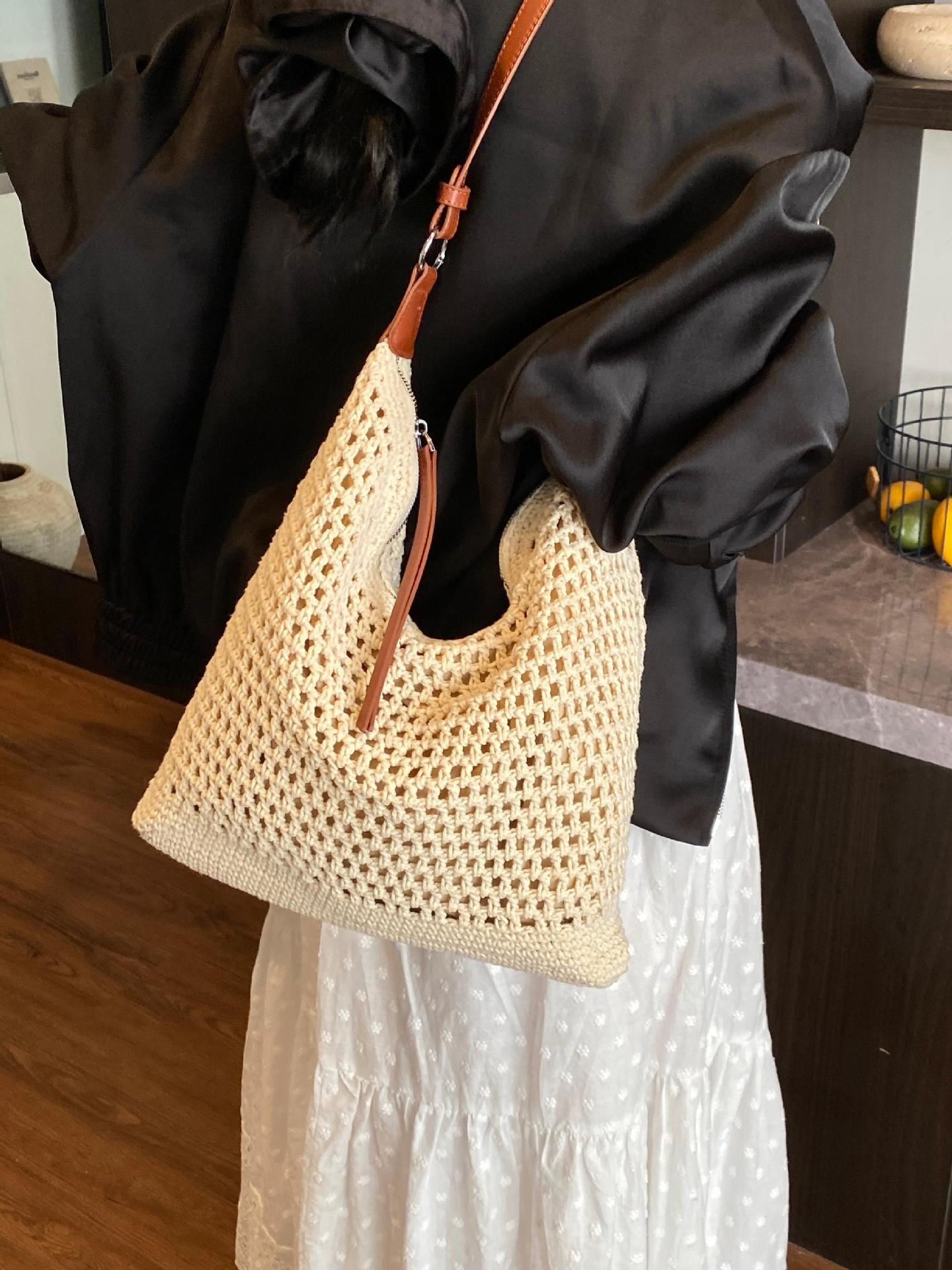 Venta caliente de verano nuevo producto bolsa tejida hueca para mujer 2025 bolsa de playa estilo vacaciones bolsa de paja de gran capacidad bolsa de cubo