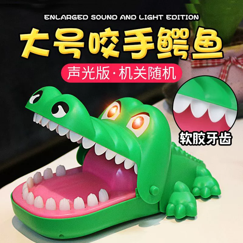 Crocodile, toy for boys, bites finger