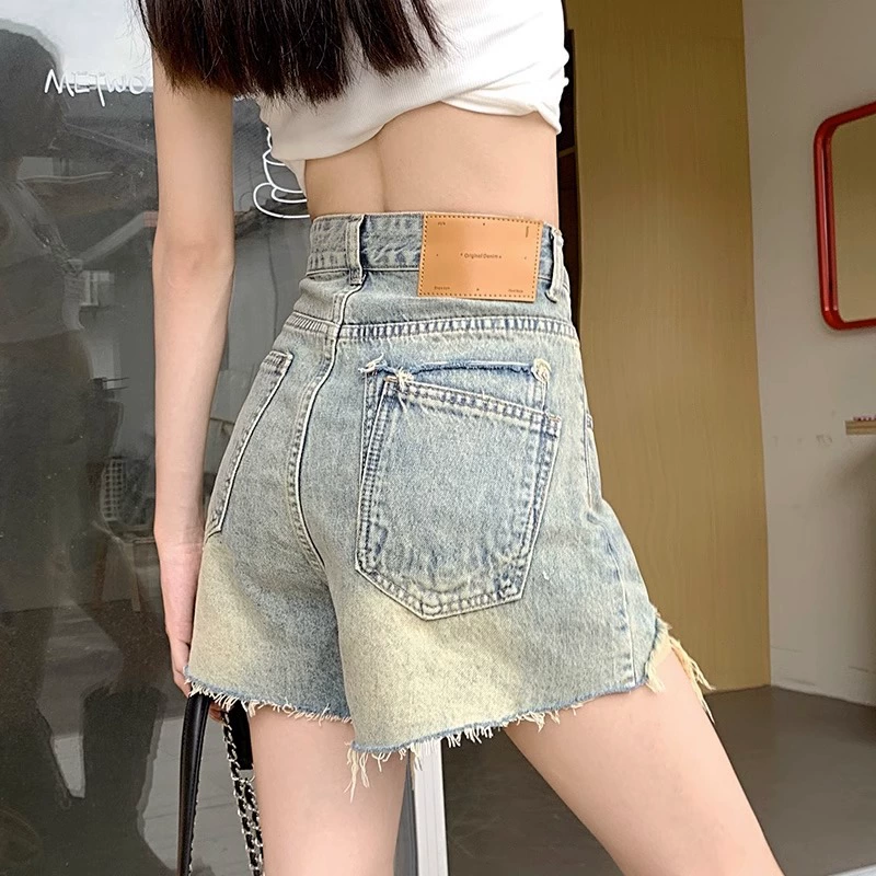Denim high‑waist shorts (women), retro fitted A‑line, frayed hem, summer casual