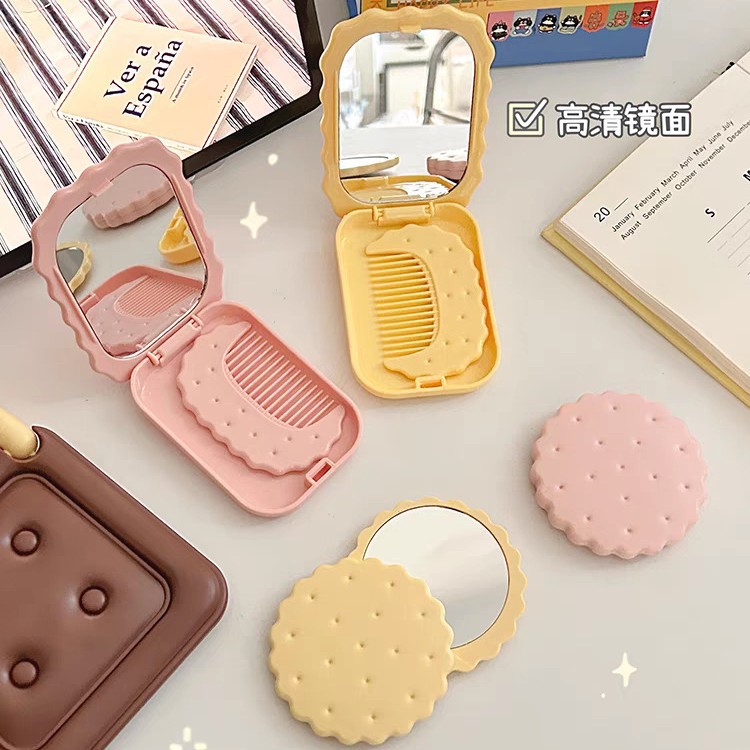 Espejo plegable con forma de galleta, espejo de maquillaje para mujer con peine, espejo de mano para retoques para estudiantes, espejo de maquillaje plegable, exclusivamente para ventas transfronterizas.
