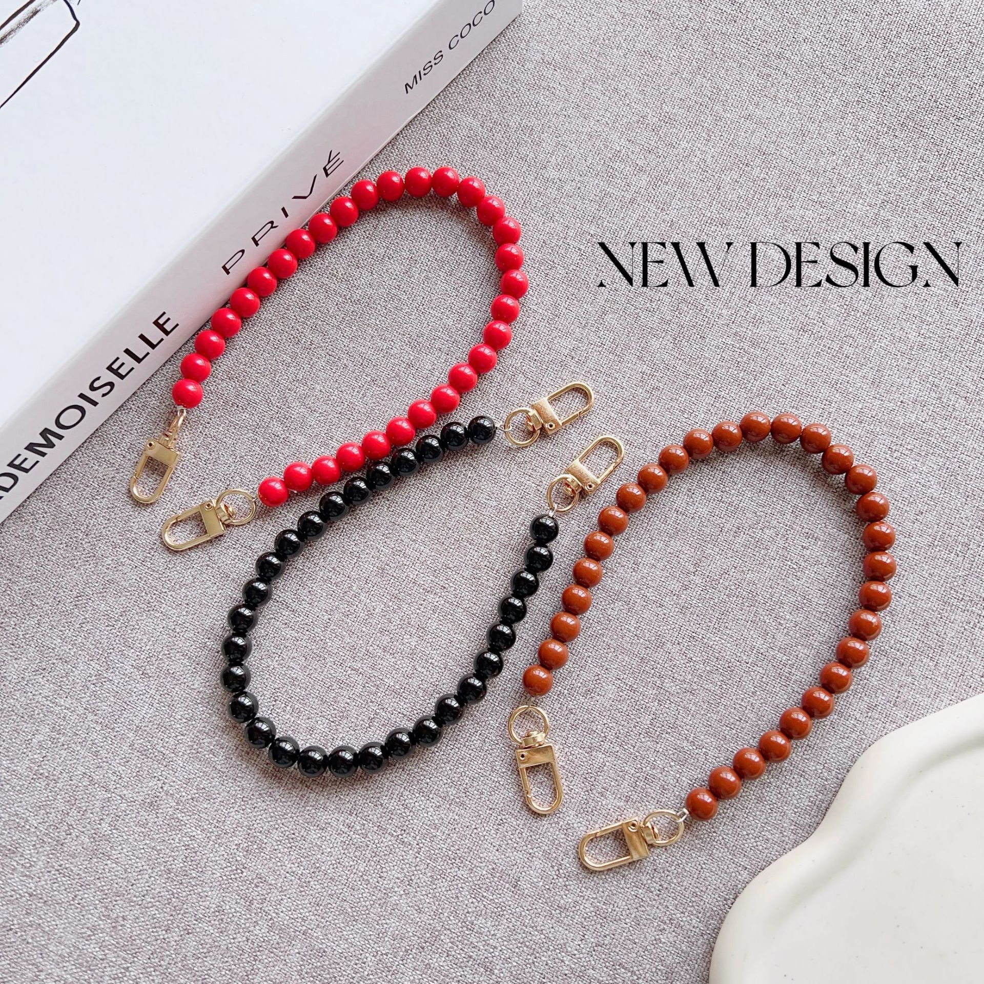 Nuevo estilo japonés y coreano cadena de cuentas de color sólido pulsera corta llavero bolsa de accesorios de cadena de perlas de todo fósforo cordón transfronterizo