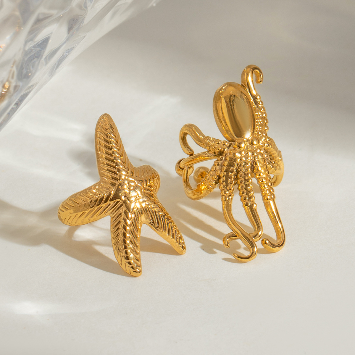 Wanxing Europa y América de acero inoxidable estrellas de mar clips de hueso de orejas de nicho de alta calidad pendientes de titanio joyas de orejas de acero pendientes transfronterizos