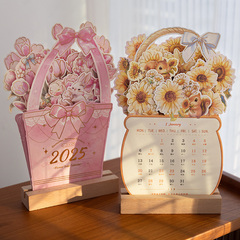 小さい日は2025年のバラの花の木の卓上カレンダーをひっくり返しません。
