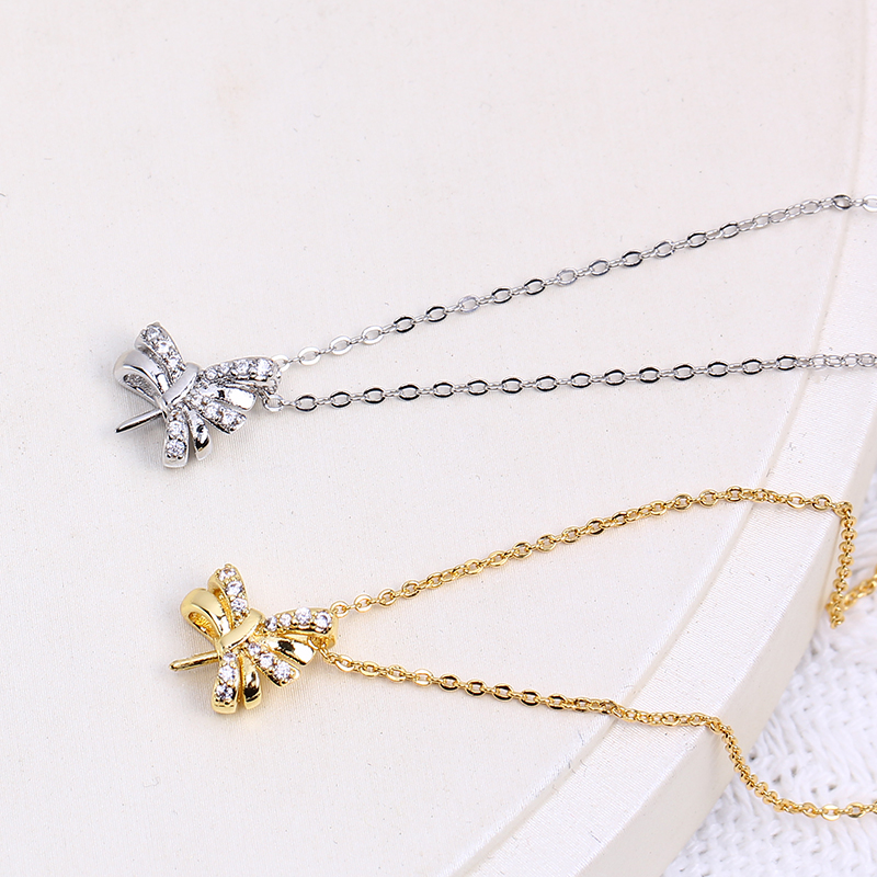 Ciondolo a fiocco con perla placcato oro per donna elegante_voghion.com
