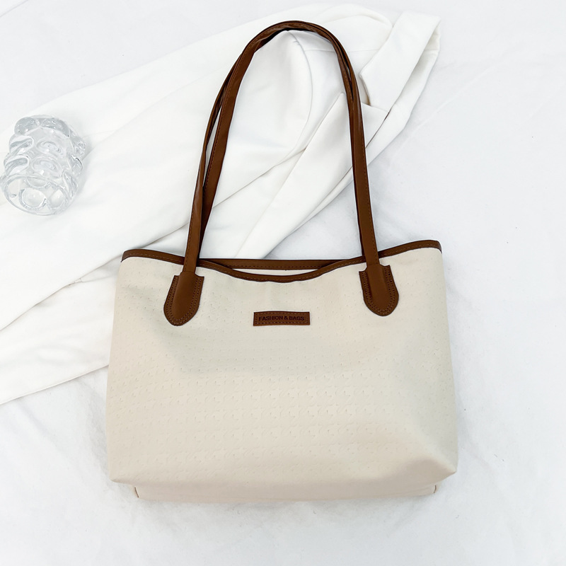 Bolsa de gran capacidad para mujeres 2024 nueva bolsa de hombro de trabajo casual, sensación avanzada de estudiantes universitarios en clase, bolsa de viaje