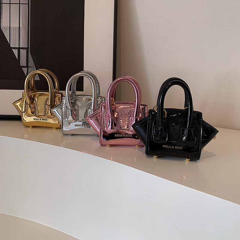 Bolso de hombro para niños y niñas de estilo coreano Bolso de mensajero para niños de color sólido de charol láser fresco de moda Bolso para niños de comercio exterior de cadena nueva