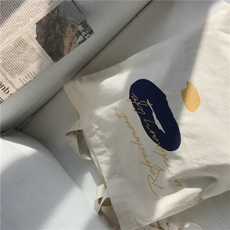E131 canvas bag, Korean-style ins hand-held shoulder bag, color block letter graffiti shopping bag, female student's search for sources Application Scenario