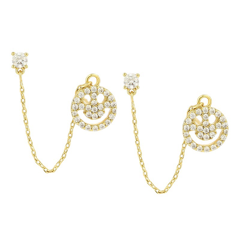 Joyas Xuping personalidad europea y americana sonriente pernos de orejas de aleación nicho ligero lujoso frío orejas de viento para mujeres exquisitas verano