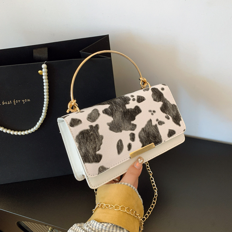 Moda coreana hermosa bolsa de mensajero occidental mujer 2025 nuevo diseño de nicho bolso de viaje personalizado todo-fósforo