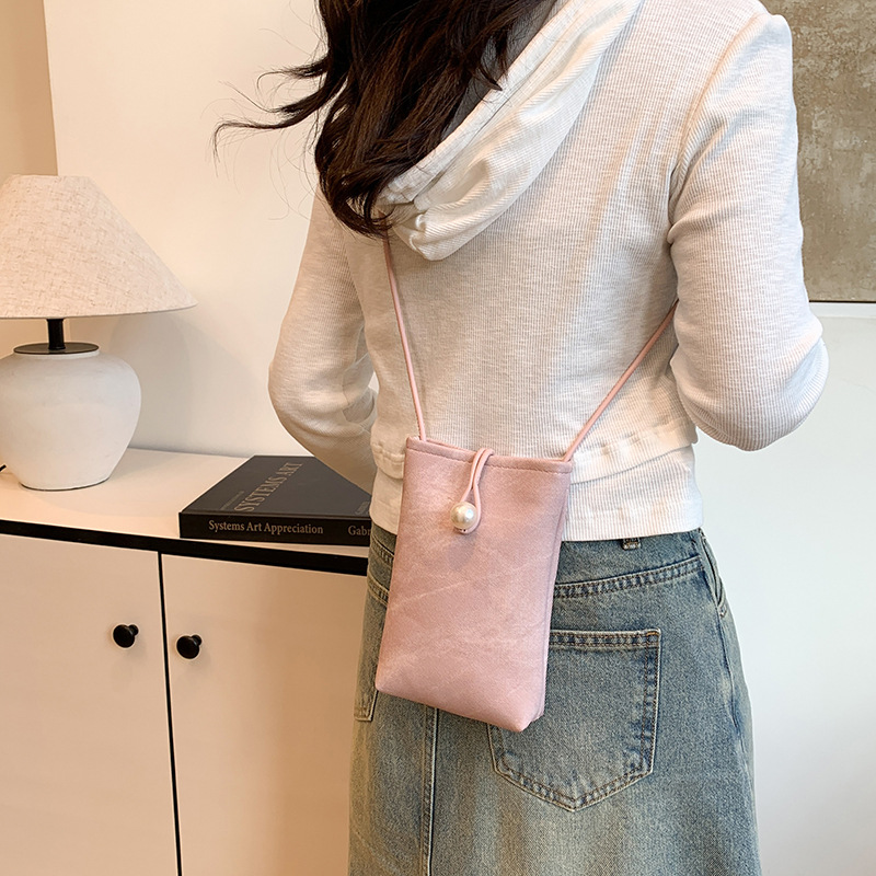 Teléfonos móviles de nicho de alta gama en primavera y verano con bolsos pequeños para mujeres 2025 nueva billetera de cuero blanco simple de un solo hombro