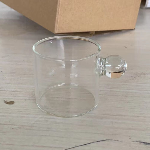 Lindo mango de bola pequeña taza de leche vidrio doméstico pequeña taza de té con mango transparente bebida de vidrio taza de leche de una sola capa taza