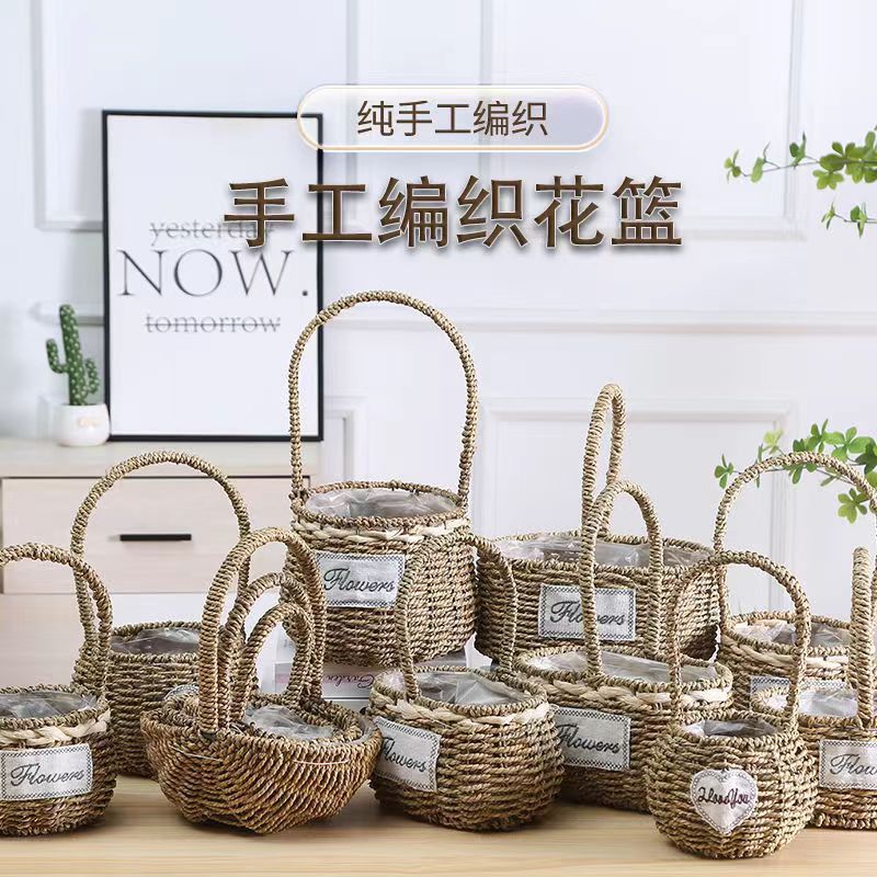 Fabricantes de cestas de flores ovales rectas de paja hechas a mano en stock al por mayor cestas de flores de paja portátiles decoración de viento pastoral