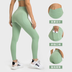 European and American new style no awkward line cross waist yoga pants high waist hip lift side pocket sports fitness nine-point pants