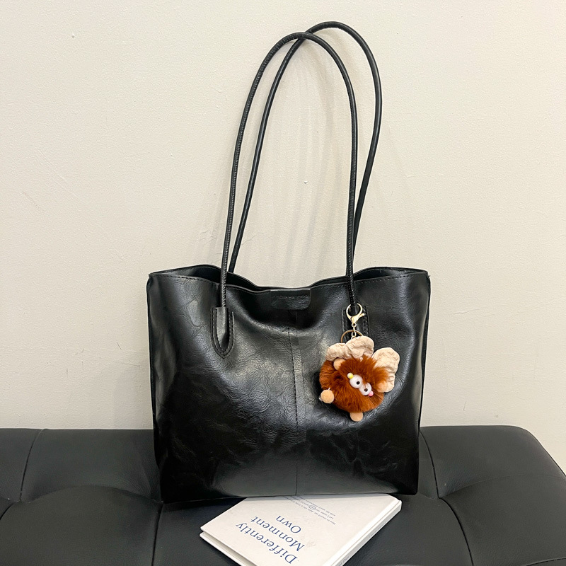 Moda de gran capacidad de la cara suave 2025 primavera nuevo colgante de ocio retro color sólido simple bolso de hombro axilar de mano