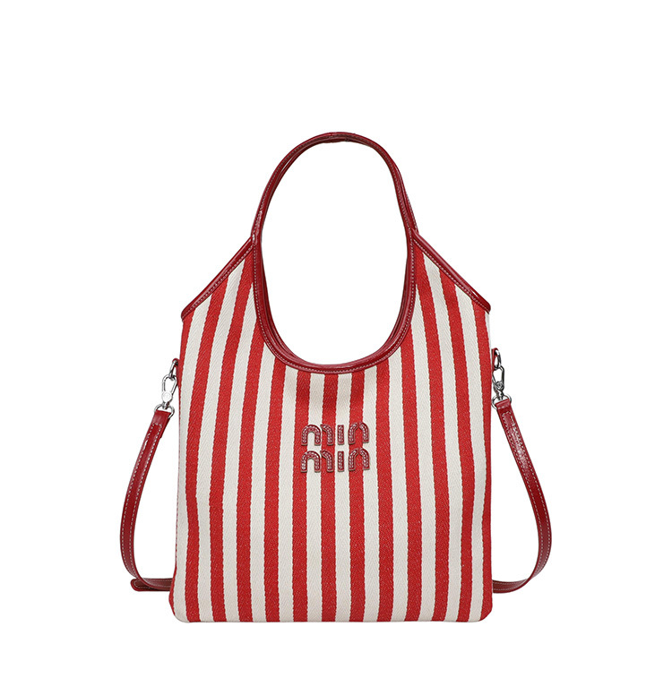 Bolsa de hombro a rayas de lona 2026 nueva sensación de lujo ligera casual diaria gran capacidad mochila