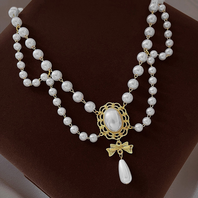 Elegante collana girocollo perle barocche con ciondolo oro_voghion.com