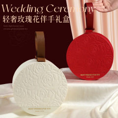 円形の手付きギフトボックス結婚式のバラの喜糖箱は中国風の手付きギフトボックスを折らないでカスタマイズできます。