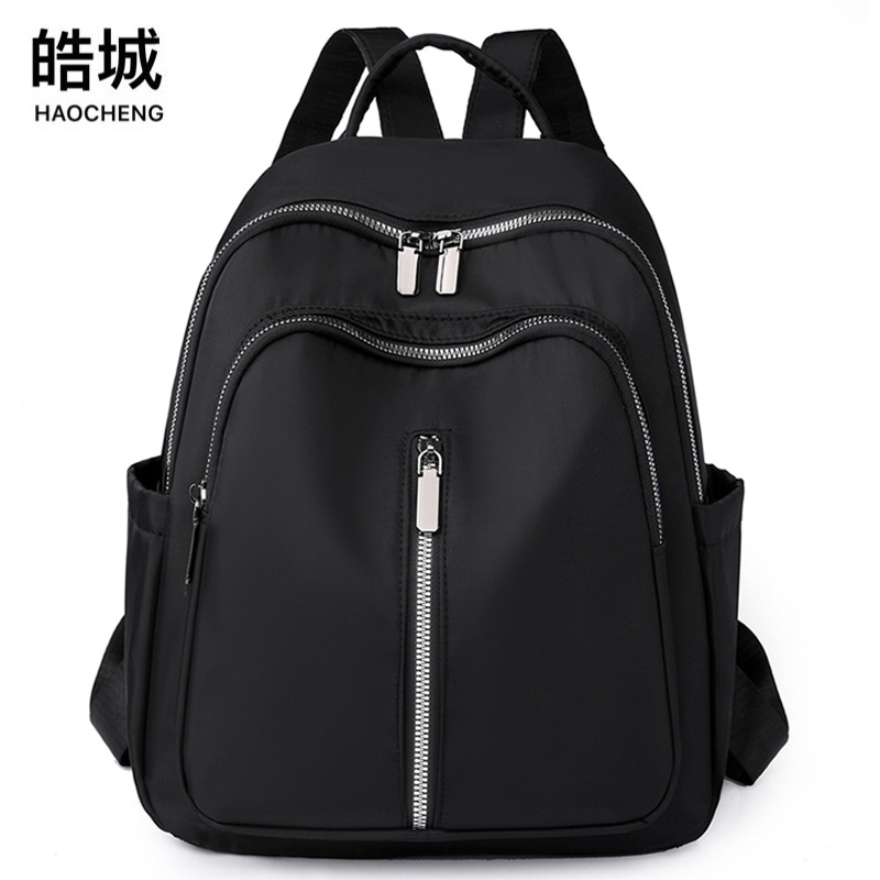 Spot al por mayor 2023 nueva mochila de nailon para mujer coreana simple y ligera mochila de viaje al aire libre mochila escolar de moda