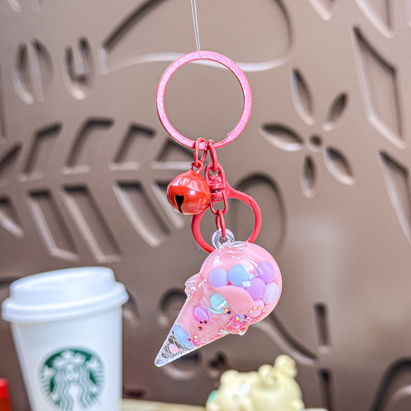 Caricatura en aceite líquido arena flotante botella mochila llavero delicado colgante accesorios accesorios máquina de muñecas pequeños regalos al por mayor