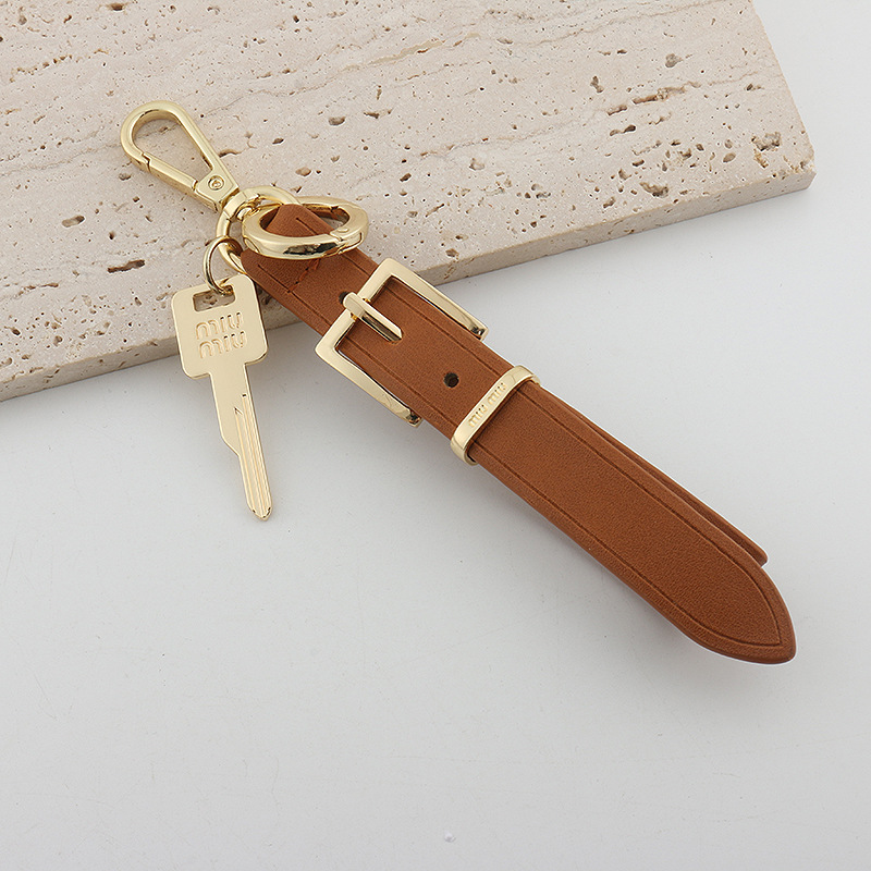 Xiaohongshu ins estilo explosivo uim caja de llaves de cuero colgante llavero de coche colgante pequeño de moda para hombres y mujeres