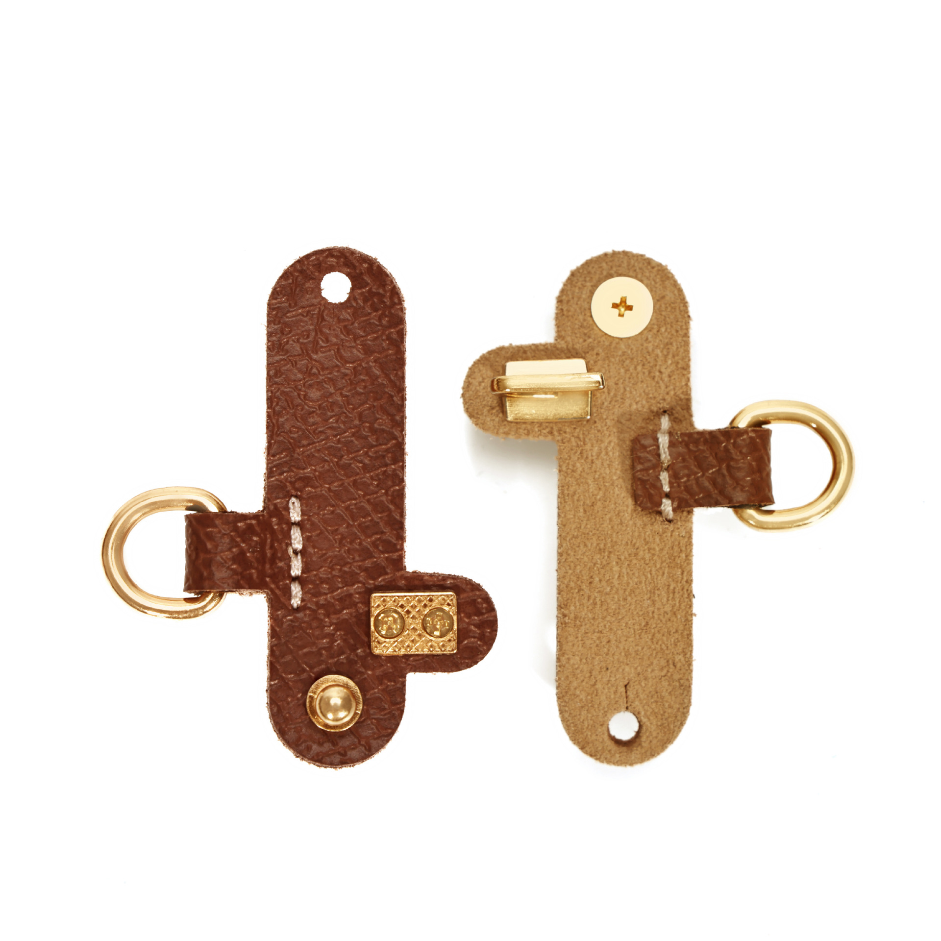 A pair of cognac color straight gold GS stitching without punching