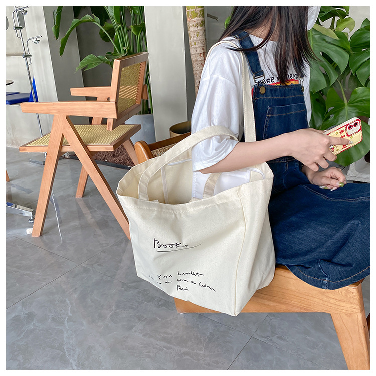 A large-capacity, sturdy Japanese-style canvas bag for women, a new 2022 simple bento handbag for girls to go to work undefined