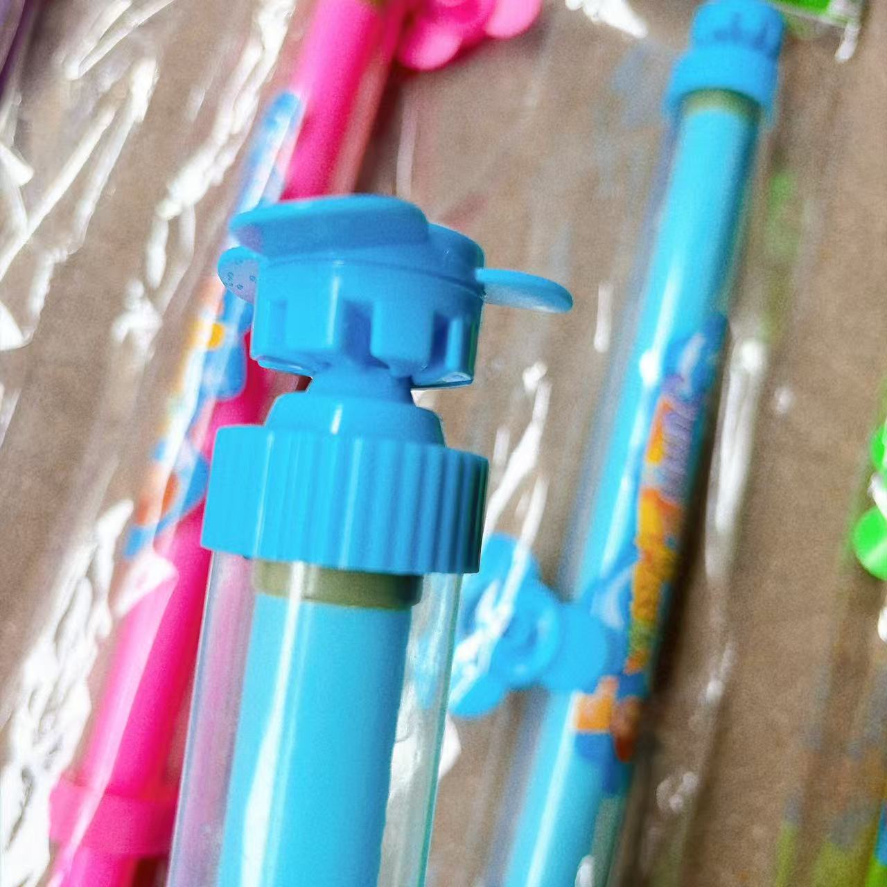 Nuevo molino de viento fuegos artificiales pistola de agua de verano playa juguetes de agua al aire libre pulverización tipo pulverización pistola de agua de agua junto al mar