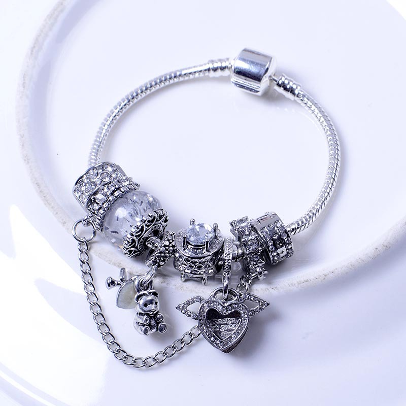 Bracciale donna perle occhio di gatto ali angelo e orsetto_voghion.com